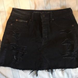 Black denim distressed mini skirt